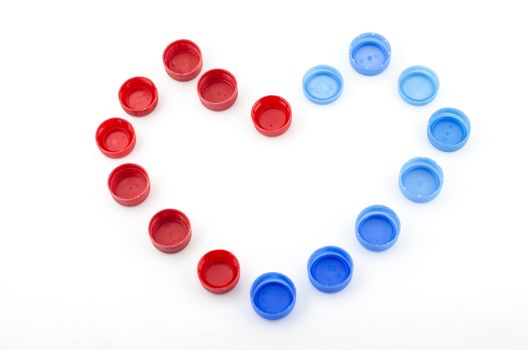 red blue heart bottle cap isolated on white background