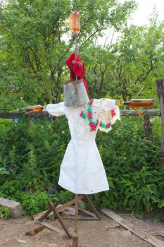 image of motley scarecrow in white docktor's smock