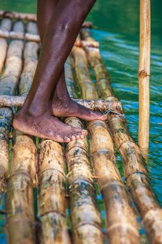 Feet of River Boat and Captain on Martha Brae River in Jamaica