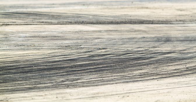 Background with tire marks on road track