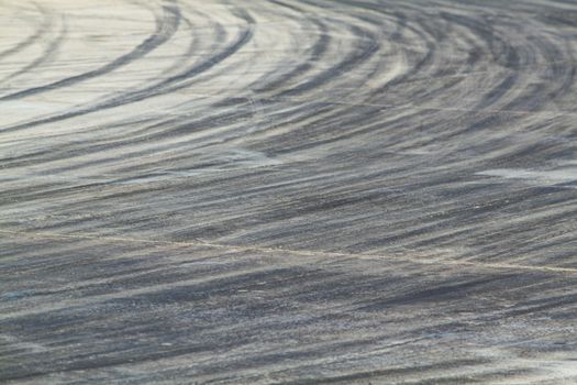Background with tire marks on road track
