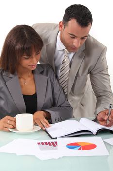 Man and woman interpreting financial results