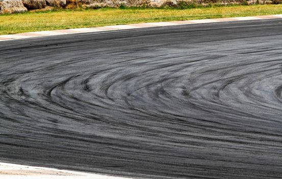 Background with tire marks on road track