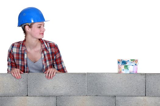 Female builder with money