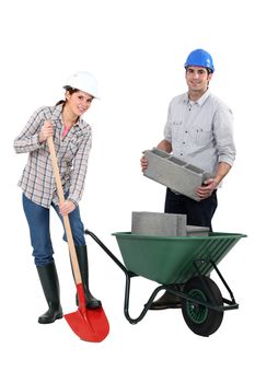 female bricklayer with shovel and male counterpart