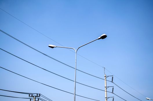 street light and Electricity post on blue sky