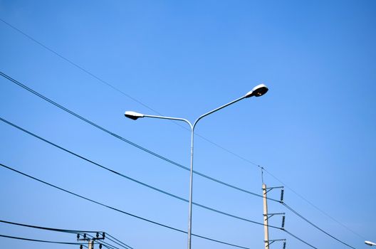 street light and Electricity post on blue sky