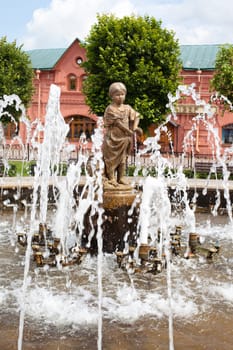 Statue of a little girl in the fountain
