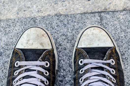  blue dirty Sneakers on street on free day