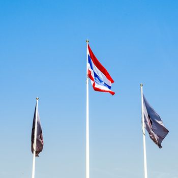 Thai flag with two another flag and bule sky background