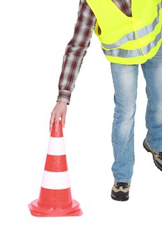 Worker with a traffic cone