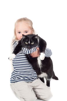 Shot of little cute girl with black cat in studio