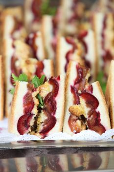 Baked fruity desserts on display on a buffet table at a wedding ceremony or catered function