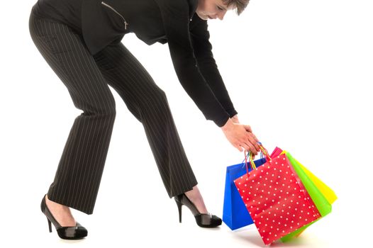 a girl with a lot of shopping bags in all kind of colors