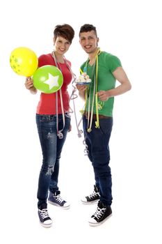 a boy and a girl with balloons and a birthdaycake