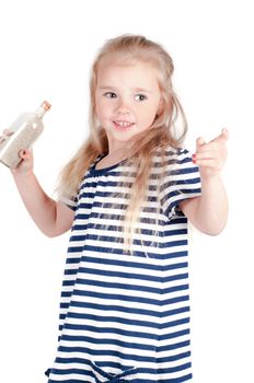 Shot of little cute girl with bottle in studio