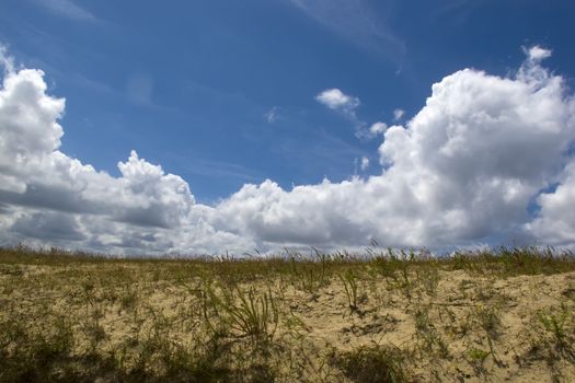 Sand Dunes with a blue sky with clouds on a Sunny day, in France