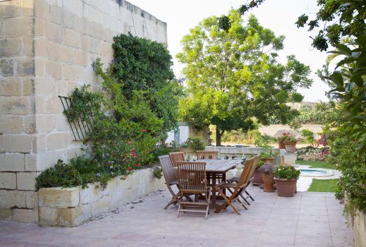 A traditional Mediterranean farmhouse garden in Malta, Europe with swimmingpool