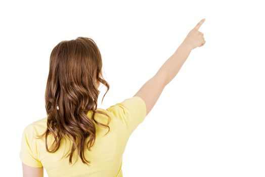 Happy , excited young woman pointing on copy space, isolated on white