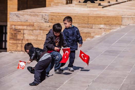 ANKARA, TURKEY ��� APRIL 16: Three unidentified boys prepare to honor Mustafa Kemal Atat��rk, the leader of the Turkish War of Independence on April 15, 2012 in Ankara, Turkey prior to Anzac Day.  Turkish people thank and remember allies from Australia and New Zealand who fought at the battle of Galipoli in the Ottoman Empire during World War I.