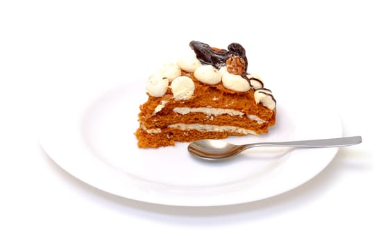 Piece of sweet cake on plate, closeup, white background