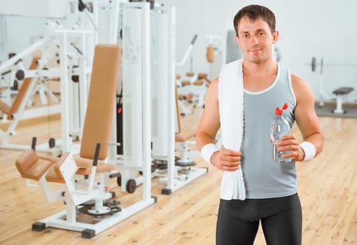 a sportsman with bottle and towel in gim