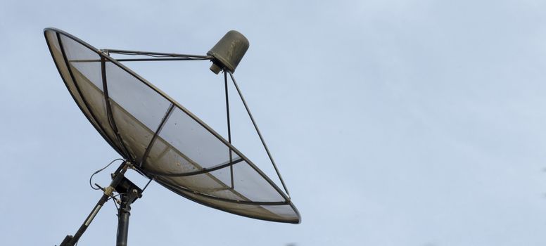 Satellite dish on blue sky background