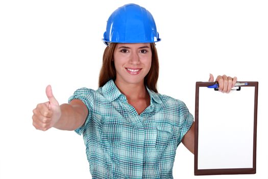 A female foreman giving the thumb up.