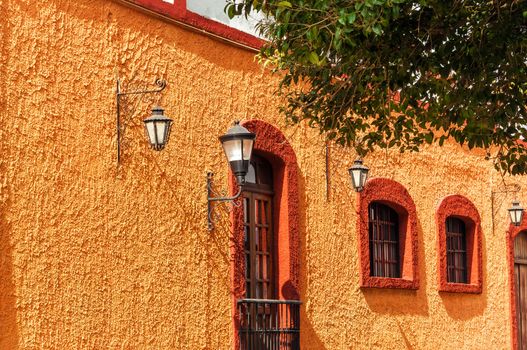 Orange and red colonial wall in San Cristobal de las Casas in Mexico