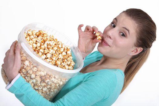 Woman eating popcorn