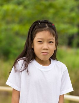 Outdoors portrait of beautiful Asian young girl