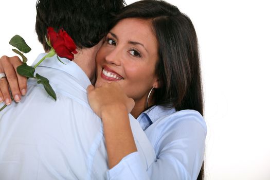 couple with rose in hand