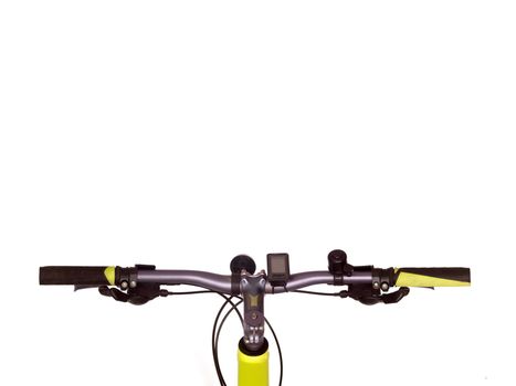 Bicycle handlebars isolated against a plain backgroubd