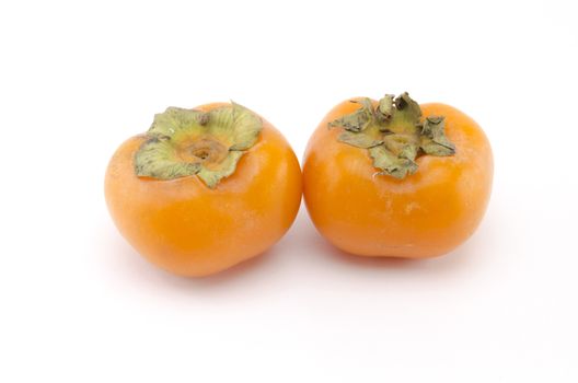 two persimmon isolated on white background
