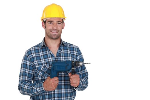 Confident handyman posing with power drill