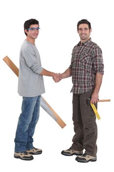 Carpenters shaking hands