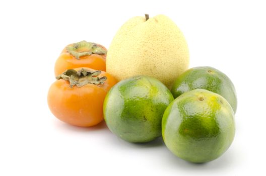 chinese pear persimon and green orange isolated on white background
