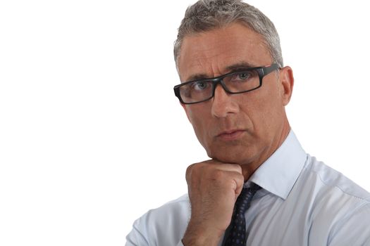 Portrait of a man wearing thick-rimmed glasses