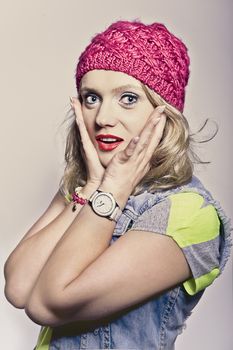 young girl in a pink covering posing