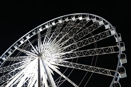 Ferris Wheel with lighting at night