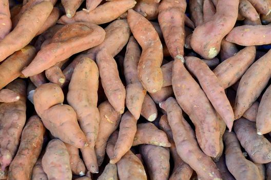 Abstract Background Of Yam (Sweet Potato) Vegetables At A Market