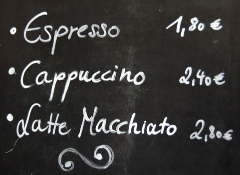 Menu For Coffee On A Blackboard Outside A European Cafe