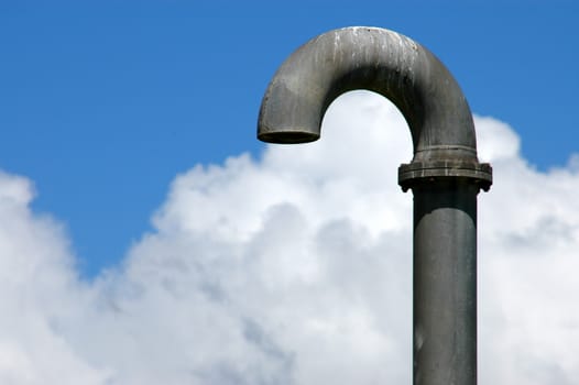 Environment image of an industrial pipe against a blue sky