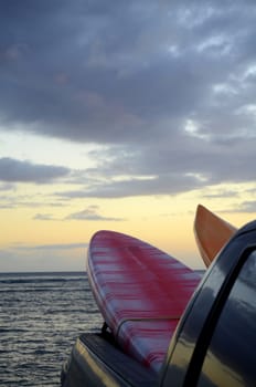 Two Surfboards In The Back Of A Truck At Sunset With Copy Space