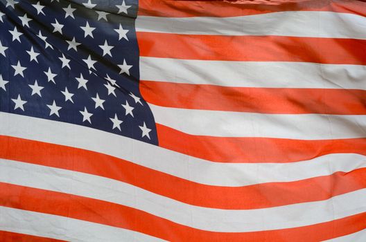 Background Texture Of USA Stars And Stripes Flag In The Wind