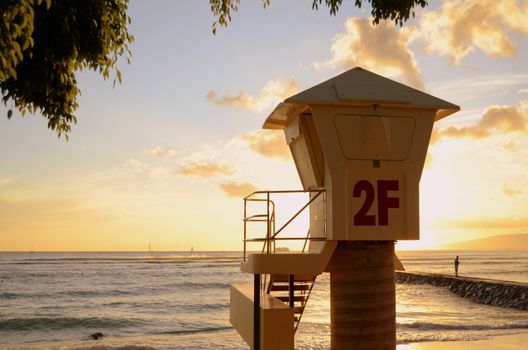 A Lifeguard Station On Waikiki Beach In Hawaii At Sunset