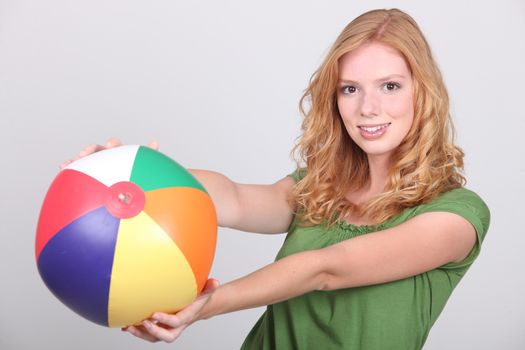 young woman with a beach ball