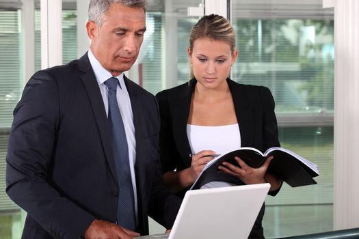 Businessman and his young assistant