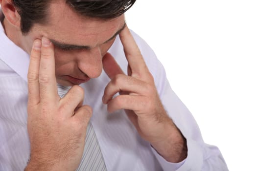 Businessman suffering from headache