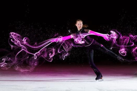 Little girl figure skating at sports arena